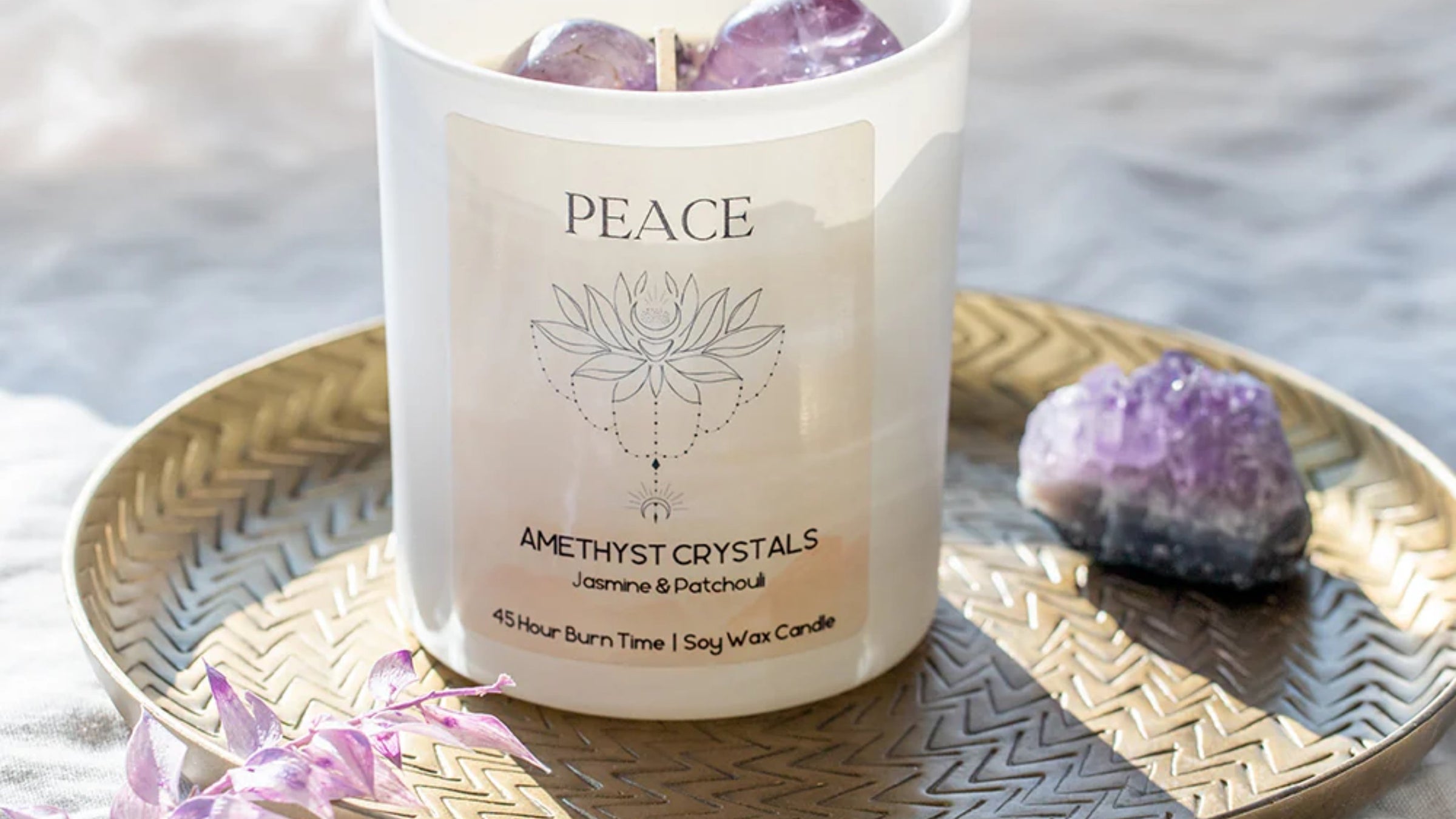 Crystal energy candles infused with intention crystals including moonstone and amethyst